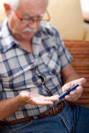 man_with_diabetes_testing_his_blood_sugar.jpg